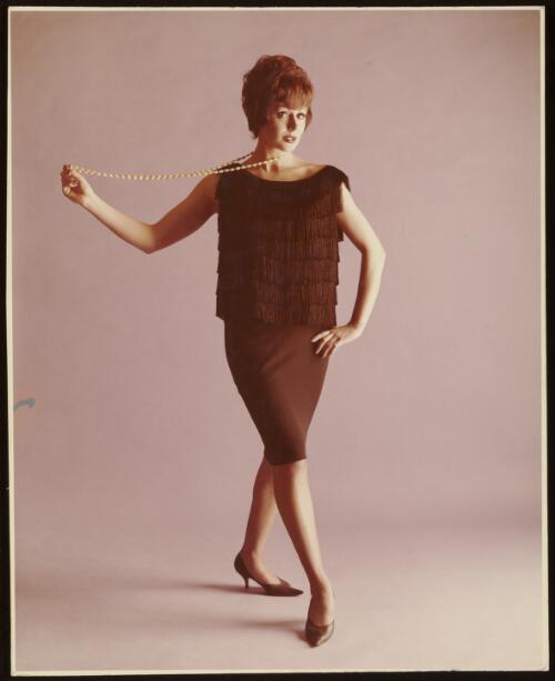 Model wearing fringe topped dress, approximately 1965 / Athol Shmith