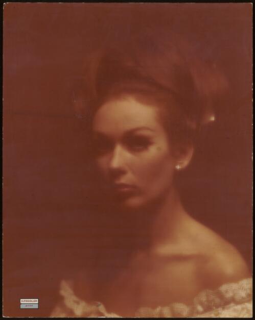 Head and shoulders of a model, approximately 1965 / Athol Shmith
