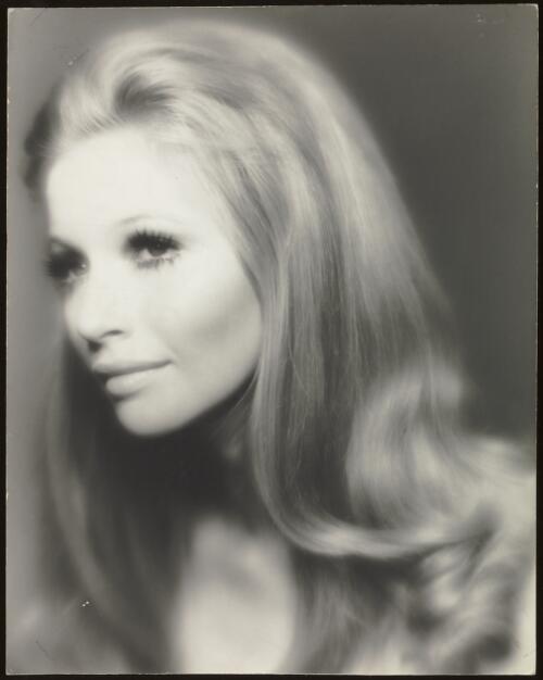 Portrait of a fashion model with long hair, approximately 1965 / Athol Shmith