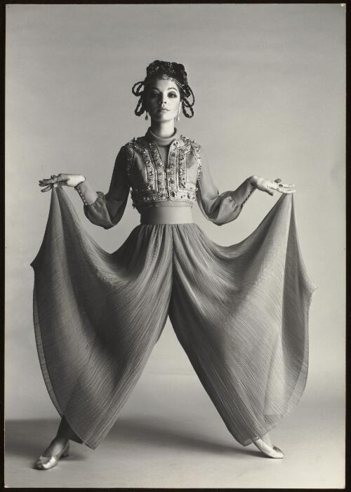 Model wearing wide legged evening pants, approximately 1970 / Athol Shmith