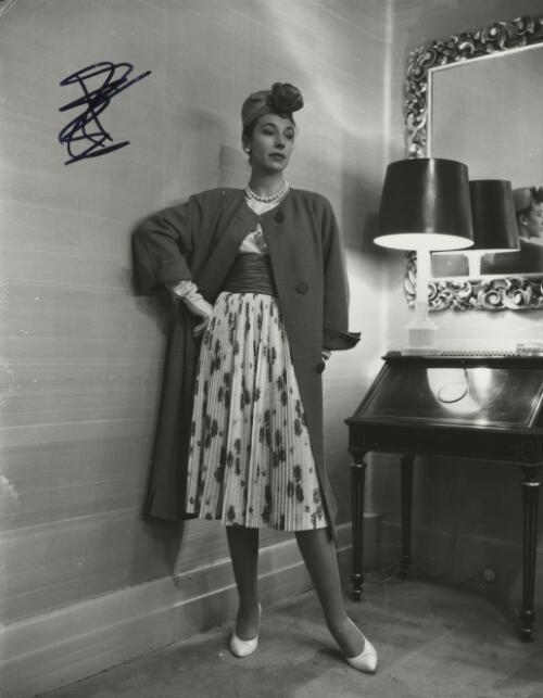 Fashion model posing beside a lamp, approximately 1968, 6 / Athol Shmith