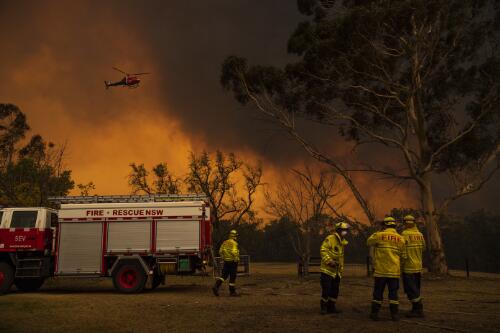 A fire engine and four firefighters preparing to fight a bushfire burning out of control at Green Wattle Creek, Orangeville, New South Wales, 6 December 2019 / Matthew Abbott