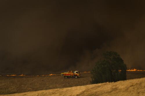 A fire truck in front of the Dunns Road fire burning out of control, near Maragle, New South Wales, 10 January, 2020 / Matthew Abbott