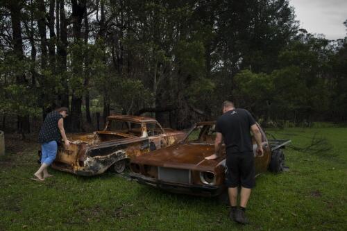 Maree Fletcher and Michael Fletcher visiting their rural property with burnt out cars that were destroyed during the bushfires, Porters Creek Road, Yatte Yattah, New South Wales, 15 February, 2020 / Matthew Abbott