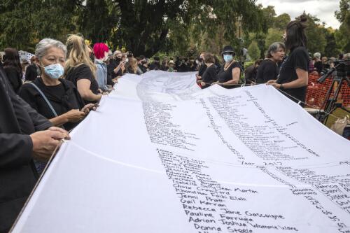 Demonstrators holding the Lost Petition, at the Women's March4Justice rally, Treasury Gardens, Melbourne, 15 March 2021 / Leigh Henningham