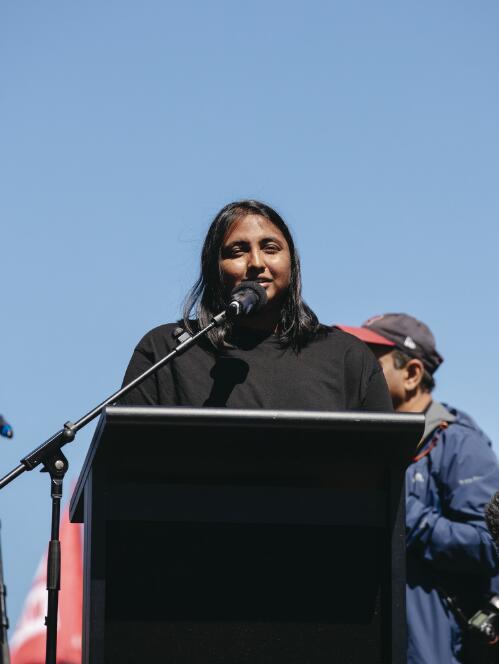 Madhumitha Janagaraja addressing crowds outside Parliament House, at the Women's March4Justice rally, Canberra, 15 March 2021 / Claire Williams