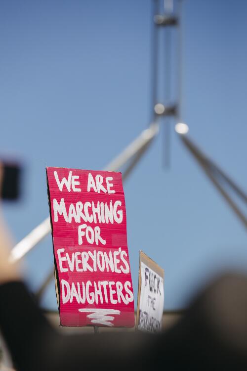 Protesters holding a placard that reads We are marching for everyone's daughters, at the Women's March4Justice rally, Canberra, 15 March 2021 / Claire Williams