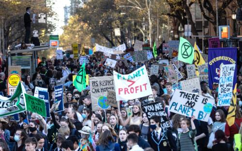 Protesters holding placards marching through the city streets during the School Strike 4 Climate rally, Melbourne, 21 May 2021, 3 / Leigh Henningham