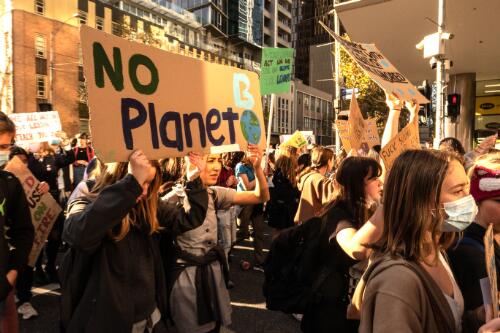 Protesters holding placards marching through the city streets during the School Strike 4 Climate rally, Melbourne, 21 May 2021, 5 / Leigh Henningham