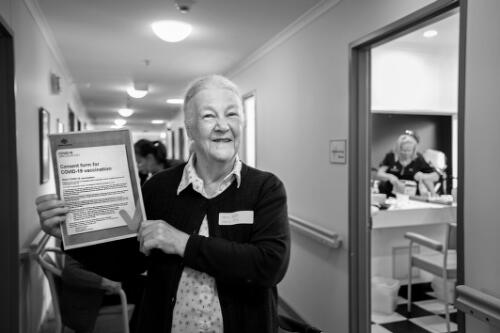 Margaret Wheeler, a resident of Trentham Aged Care Facility, showing her consent form for COVID-19 vaccination, Trentham, Victoria, March 2021 / Sandy Scheltema