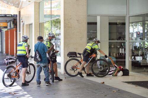 Police bike patrol handing out face masks to the homeless, Hay Street Mall, Perth, Western Australia, 3 February, 2021 / Philip Gostelow