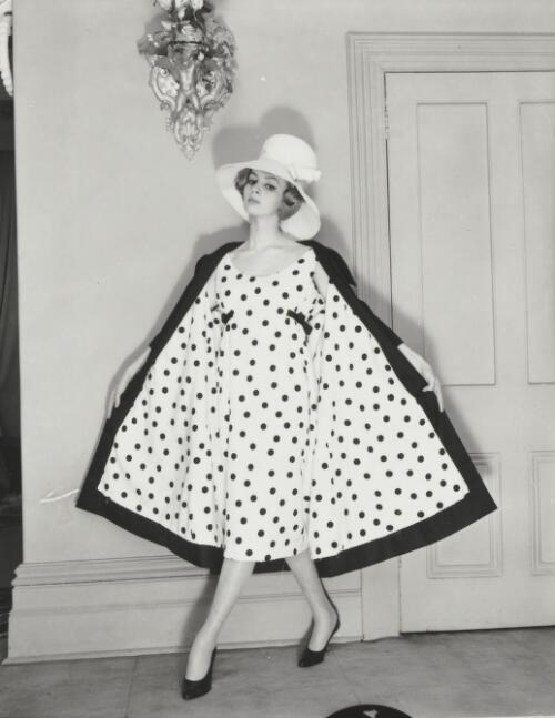 A model posing in a spotted dress, approximately 1968, 2 / Athol Shmith