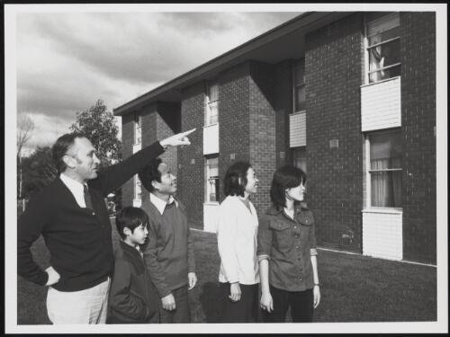 Housing officer, Mr Tony Destradi talking to some members of a Vietnamese family, Melbourne, Victoria, 1979 / Australian Information Service photograph by Patrick McArdell