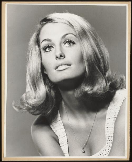 Model with blond hair and a pendant, approximately 1965 / Athol Shmith