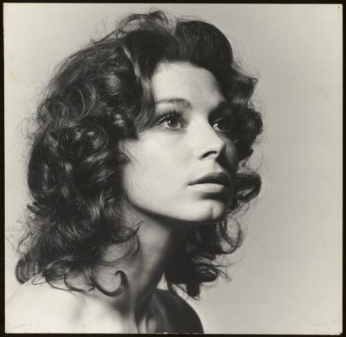 Fashion model with dark curly hair, approximately 1968 / Athol Shmith