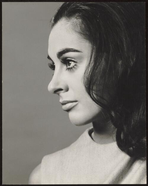 Left profile of a model with dark hair and false eyelashes, approximately 1960 / Athol Shmith