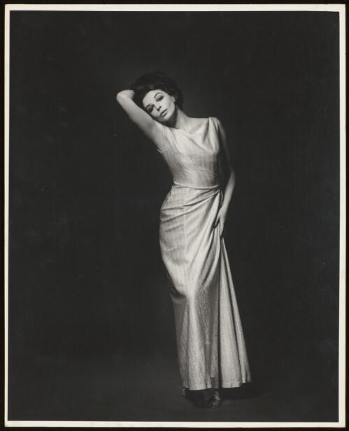 Dawn Diedricksen wearing an evening gown, approximately 1960 / Athol Shmith