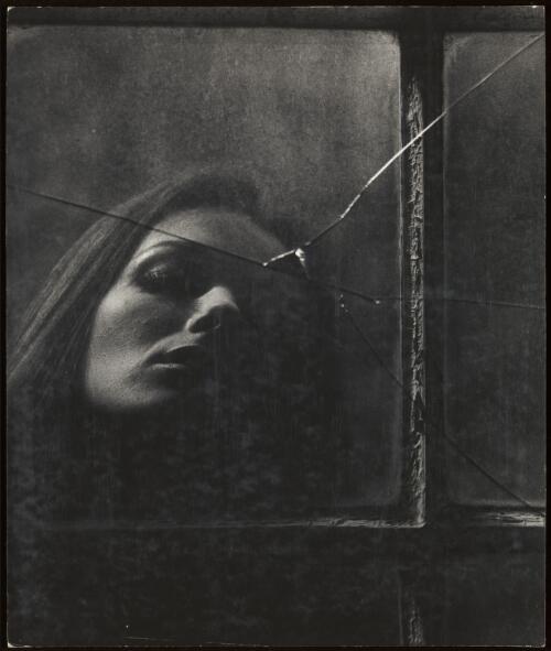Portrait of a woman reflected in a broken mirror / Athol Shmith