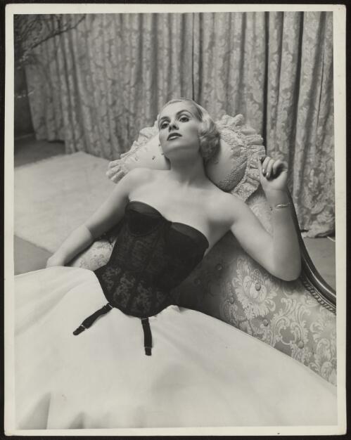Marianne Liedloff posing in a corset, approximately 1964 / Athol Shmith