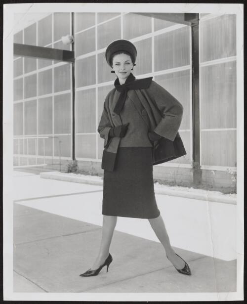 Model wearing woollen suit and hat, approximately 1960 / Athol Shmith