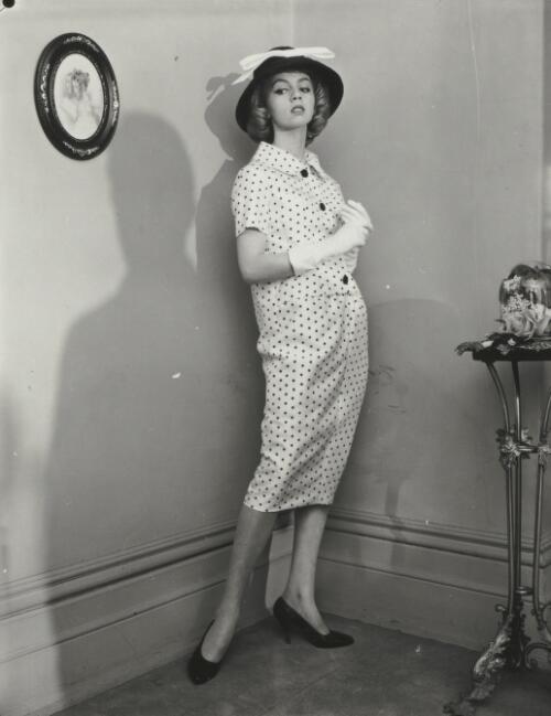 Fashion model in a spotted dress and hat, approximately 1965, 1 / Athol Shmith