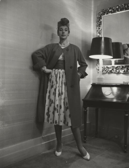 Fashion model posing beside a lamp, approximately 1968, 2 / Athol Shmith