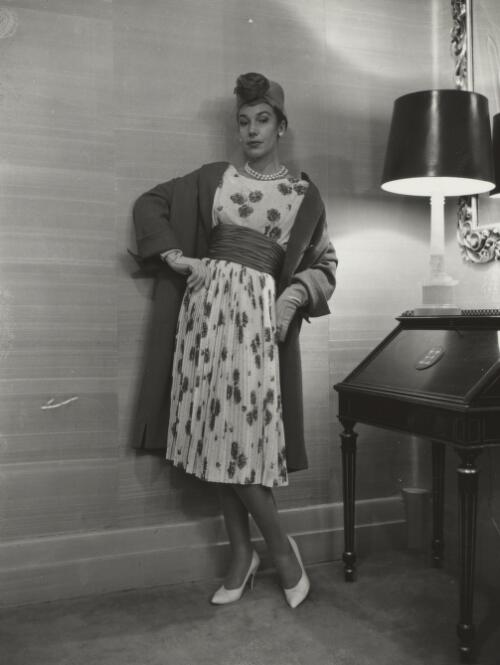 Fashion model posing beside a lamp, approximately 1968, 3 / Athol Shmith