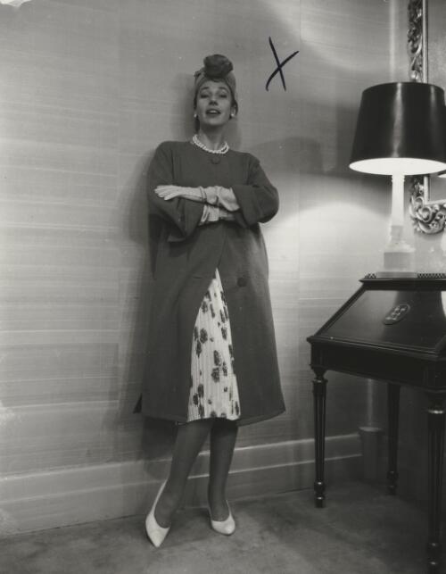 Fashion model posing beside a lamp, approximately 1968, 4 / Athol Shmith