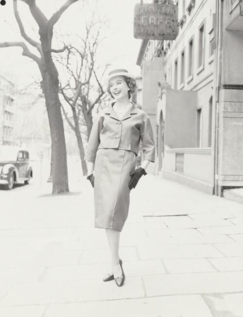 Fashion model posing near a cafe, approximately 1968, 2 / Athol Shmith