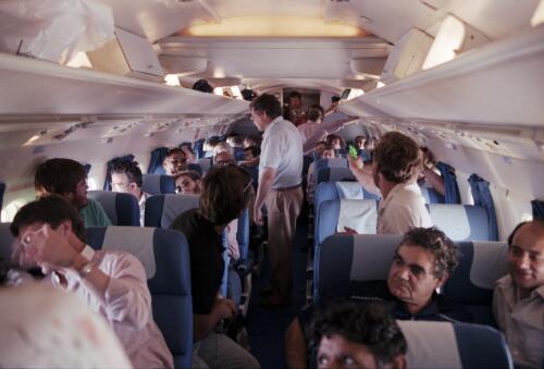 Media contingent on board a plane preparing for take off, Maralinga, South Australia, 1984 / Neil Johnston