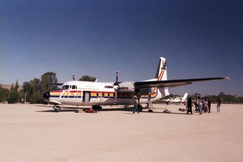 Media contingent waiting to board the De Havilland Dash 8 plane, Maralinga, South Australia, 1984 / Neil Johnston