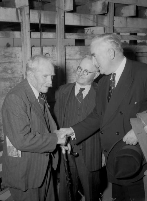 Prime Minister Menzies meeting with an elderly man, Cessnock, New South Wales, 10 March 1951