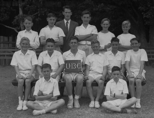 Group portrait of Sydney Grammar School pupils' cricket team and coach, Sydney, 14 November 1951, 12