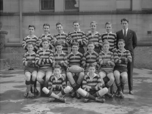 Group portrait of Sydney Grammar School pupils' rugby team 15D and their coach, Sydney, 9 August 1950, 2