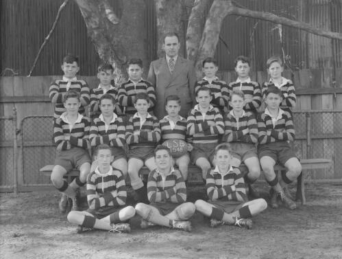 Group portrait of Sydney Grammar Lower School pupils' rugby team and coach on their first day, Sydney, 28 July 1948, 3