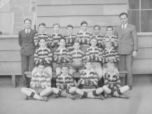 Group portrait of Sydney Grammar School pupils' rugby team and coaches on their second day, Sydney, 29 July 1948