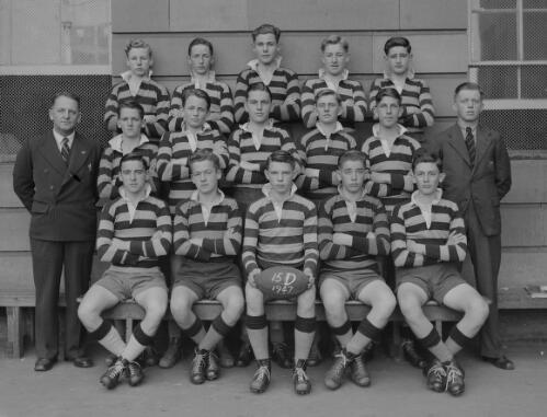 Group portrait of pupils in rugby uniform and their coaches at Sydney Grammar School, 31 June 1947, 1