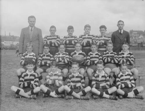 Group portrait of Sydney Grammar Lower School pupils' rugby team and coaches, Sydney, 1949, 3