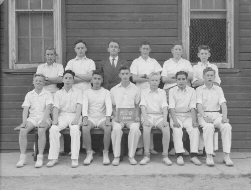Group portrait of Sydney Grammar School pupils' cricket team and coach, Sydney, 29 October 1948, 5