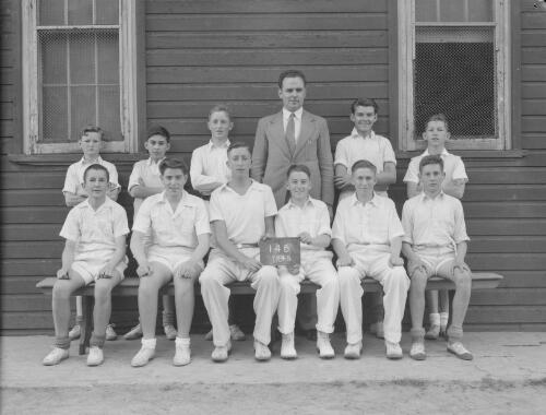 Group portrait of Sydney Grammar School pupils' cricket team and coach, Sydney, 29 October 1948, 7
