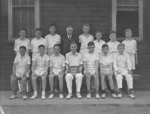 Group portrait of Sydney Grammar School pupils' cricket team and coach, Sydney, 29 October 1948, 9