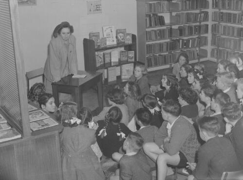 School teacher and pupils at the Wallsend Library, Newcastle, New South Wales, 3 December 1948, 2