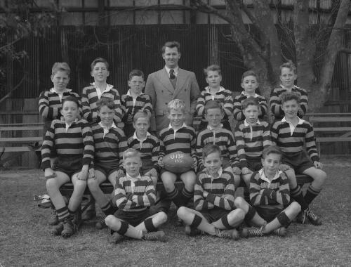 Group portrait of Sydney Grammar School pupils' rugby team Under 13F and coach, Sydney, 1951, 2