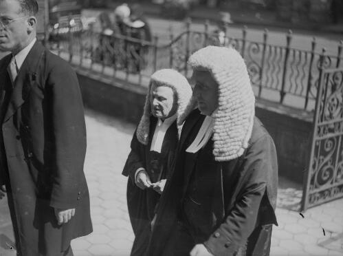Two New South Wales Supreme Court judges in wigs and gowns outside a building during the opening of the legal year, Sydney, New South Wales, approximately 1950