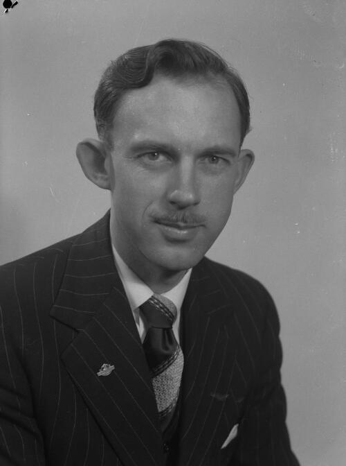 Studio portrait of a man in a pinstripe suit, 1956, 1