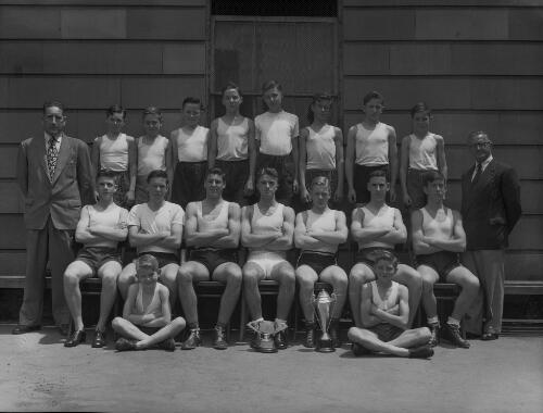 Group portrait of Sydney Grammar School pupils' sports team and coaches, Sydney, 1952