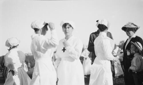 Four red cross nurses, a young boy and women, Sydney?, approximately 1915