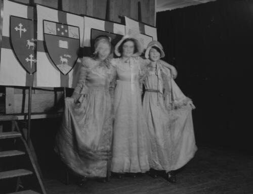 Three young women dressed in period costumes for a historical pageant, Sydney Town Hall, Sydney, 1936