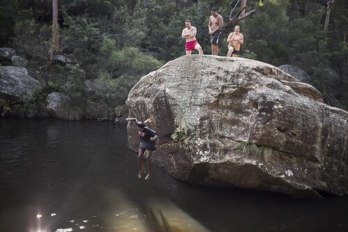 Achingol Mayom falls into the water at Jellybean pool, Blue Mountains National Park, New South Wales, 2015 / Conor Ashleigh