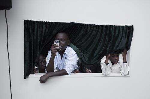 Young children taking photographs at the wedding of young South Sudanese couple, Newcastle, 2012 / Conor Ashleigh